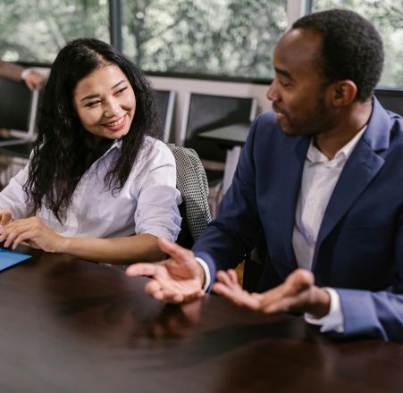 A diverse group of professionals having a collaborative business meeting indoors.
